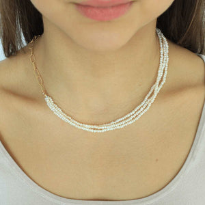 woman wearing freshwater pearl sterling silver 18k gold plated triple baroque pearl necklace