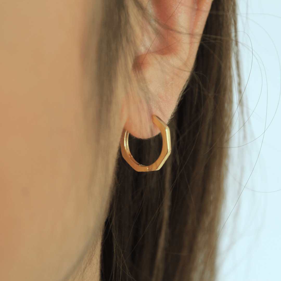 woman wearing 18k gold plated bamboo hoop earrings