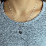 Load image into Gallery viewer, woman wearing sterling silver rhodium plated bar &amp; circle necklace
