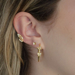 woman wearing sterling silver 18k gold plated double butterfly hoops